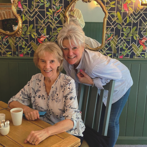 Sarah, a private care provider, and her mother sitting in a restaurant.